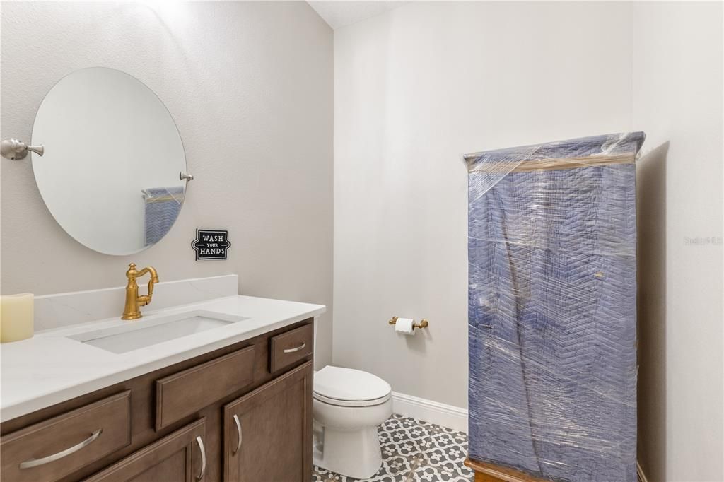 Downstairs Half Bath in back hallway.