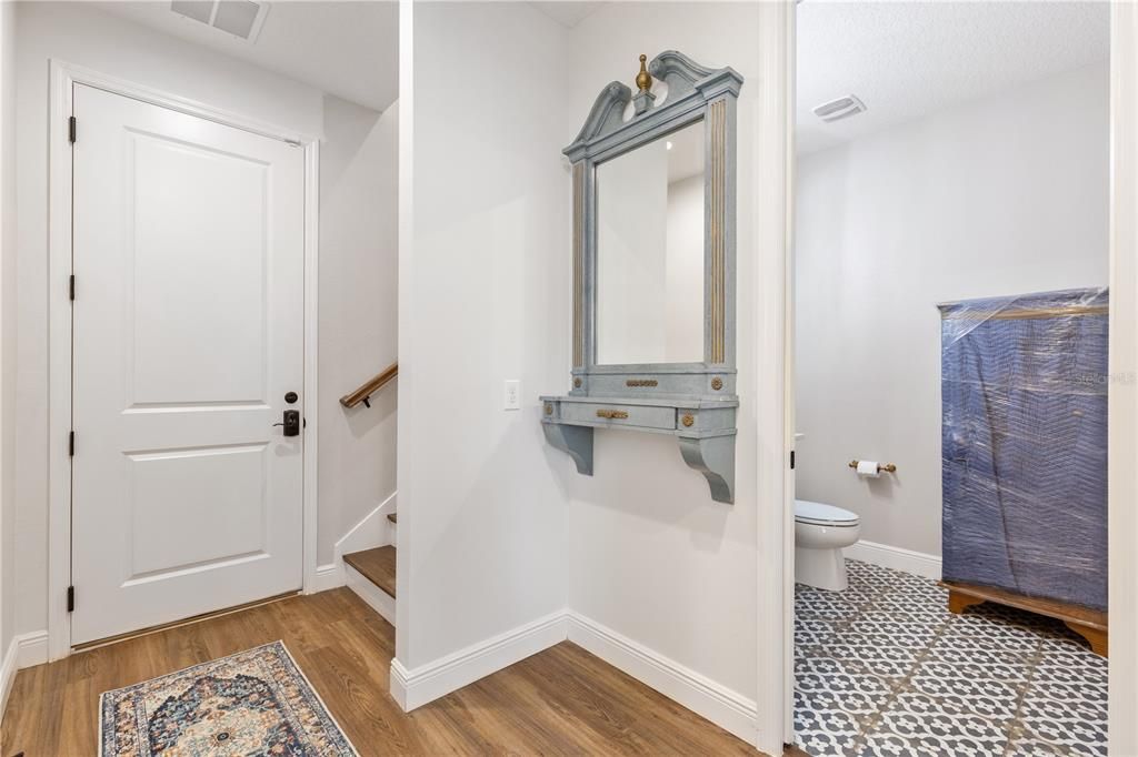 Downstairs Half Bath.  Door leads to Double garage