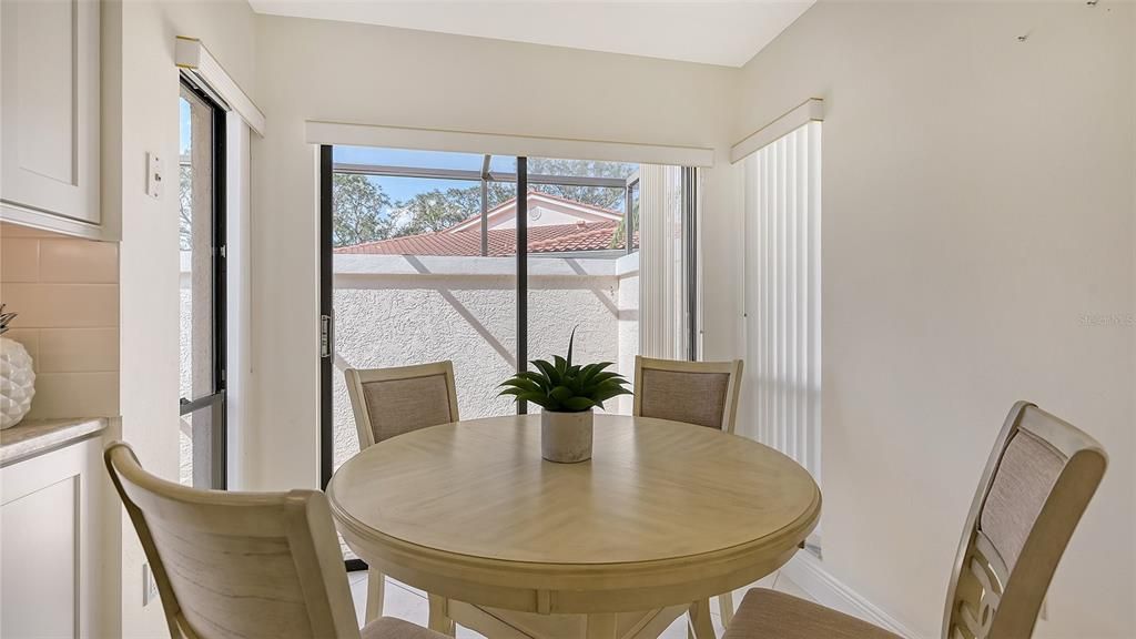 Sliding door leads to a private, screened porch