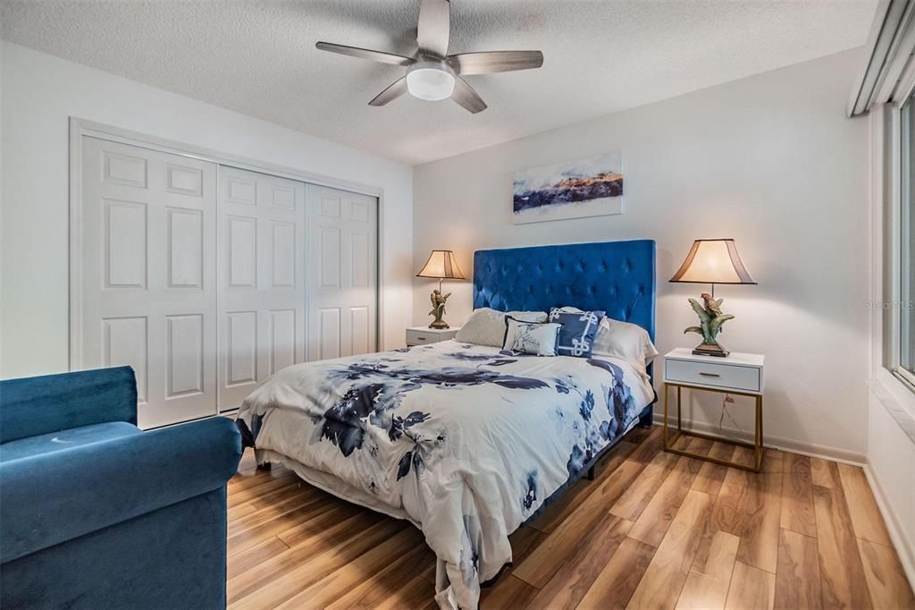 Second bedroom with wall of closets and entry to the second bathroom