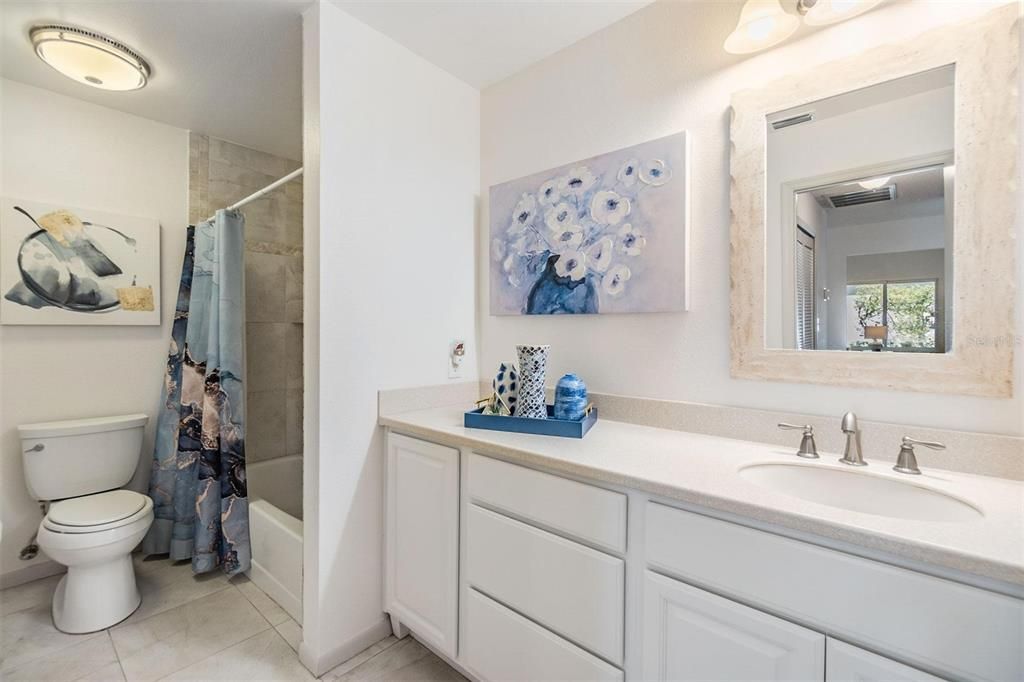 Second bathroom with beautiful tub/shower large vanity and second entry door in second bedroom