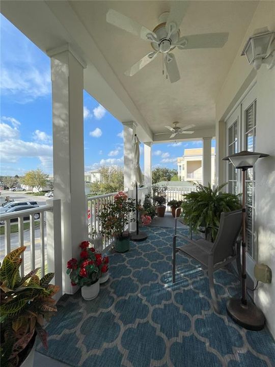 Wrap-around balcony with flooring and ceiling fans