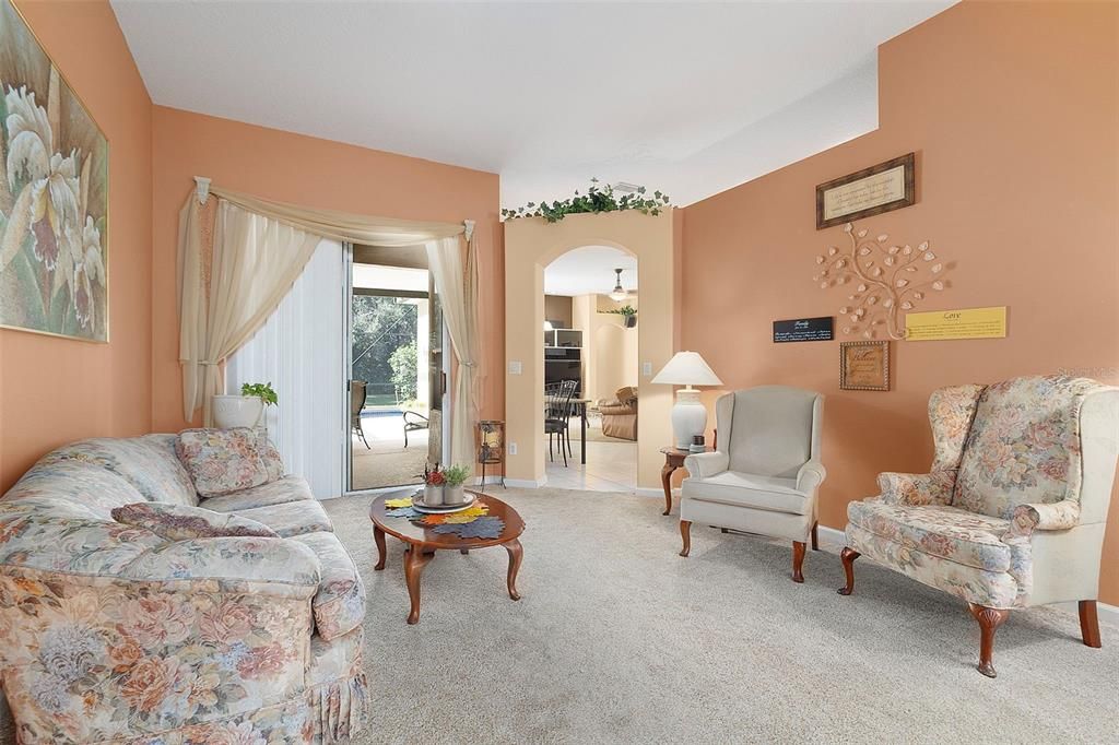 Formal Living Room at entry toward Kitchen and Family Room