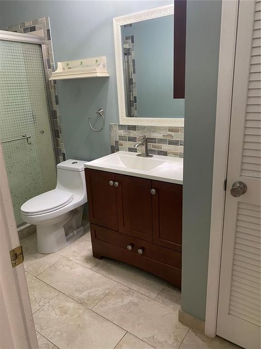 Downstairs bath with shower and linen closet