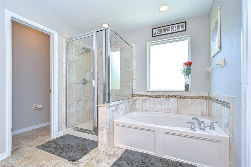 En-suite bath that includes a separate shower, and relaxing tub!