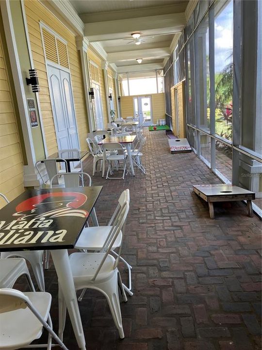 Restaurant Lanai seating w/ corn hole