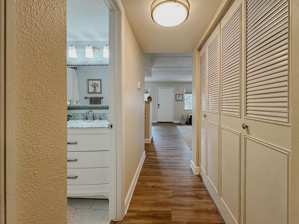 AC in the closet which also has storage shelves