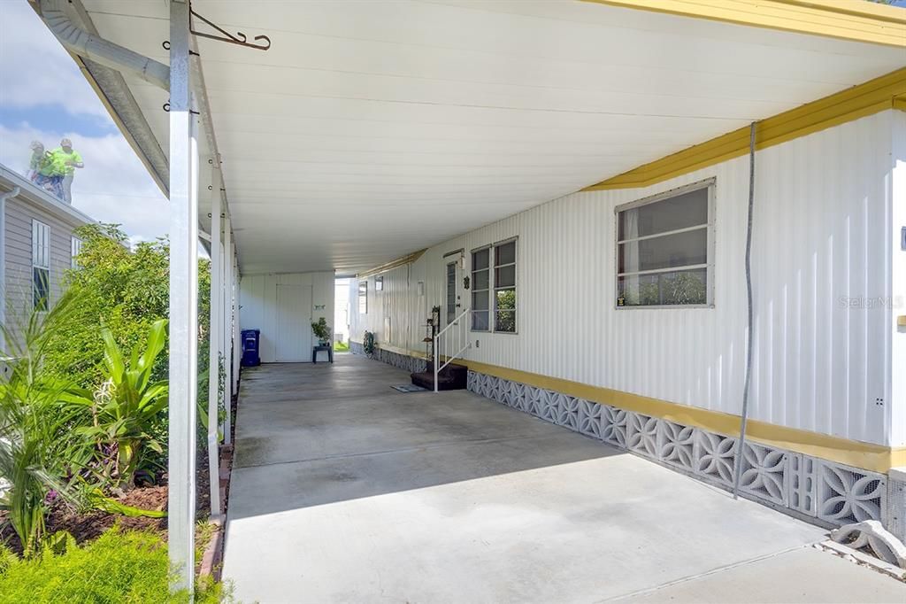 extended carport for additional parking  or entertaining.