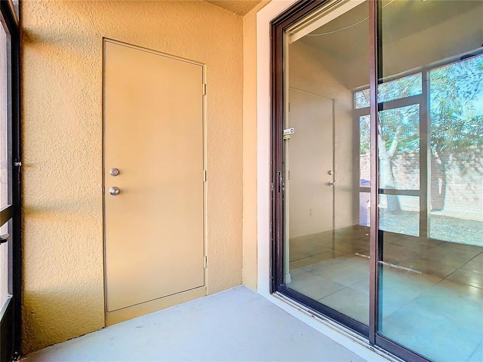 Screened in Porch with storage area.