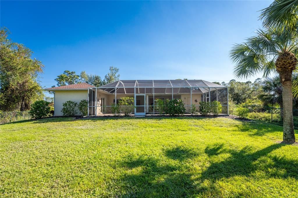 Rear of home with BR 2 on the left & large pool cage