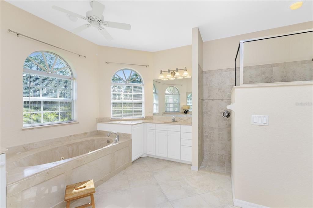 Walk-in tiled shower in owner bath