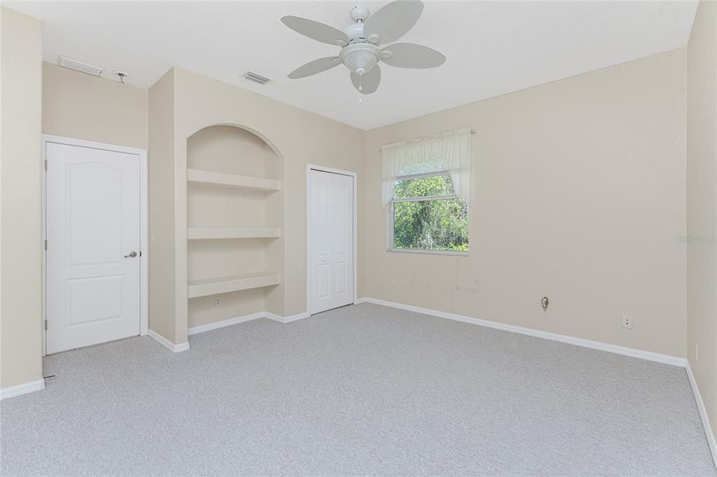 Bedroom 3 with built in shelves caters to flex space.