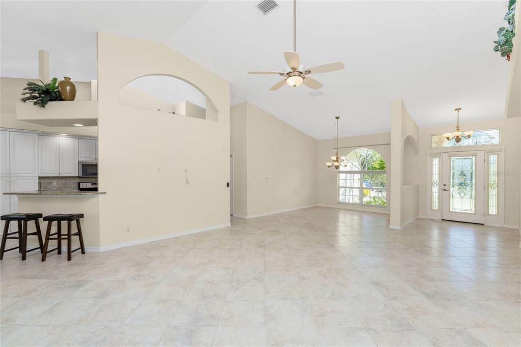 Great Room features soaring ceiling & architectual detailing.