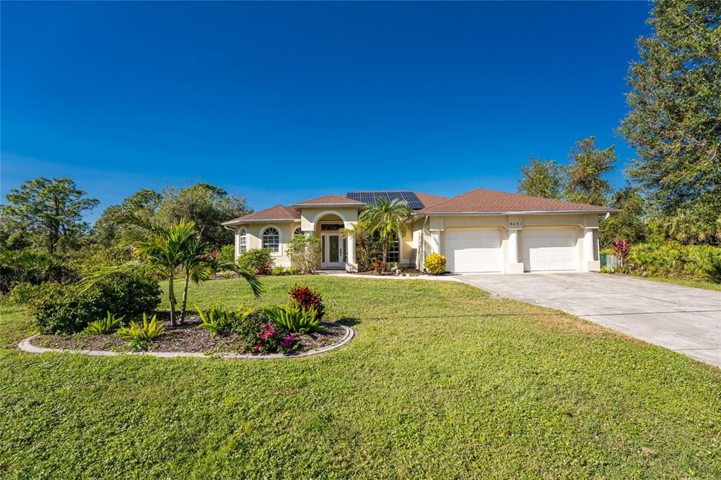 Lovely curbed garden with large front yard set back from the road