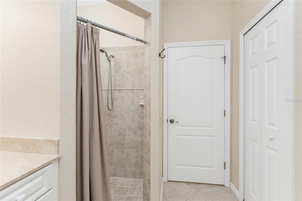 Tiled shower & linen closet in Bath 2