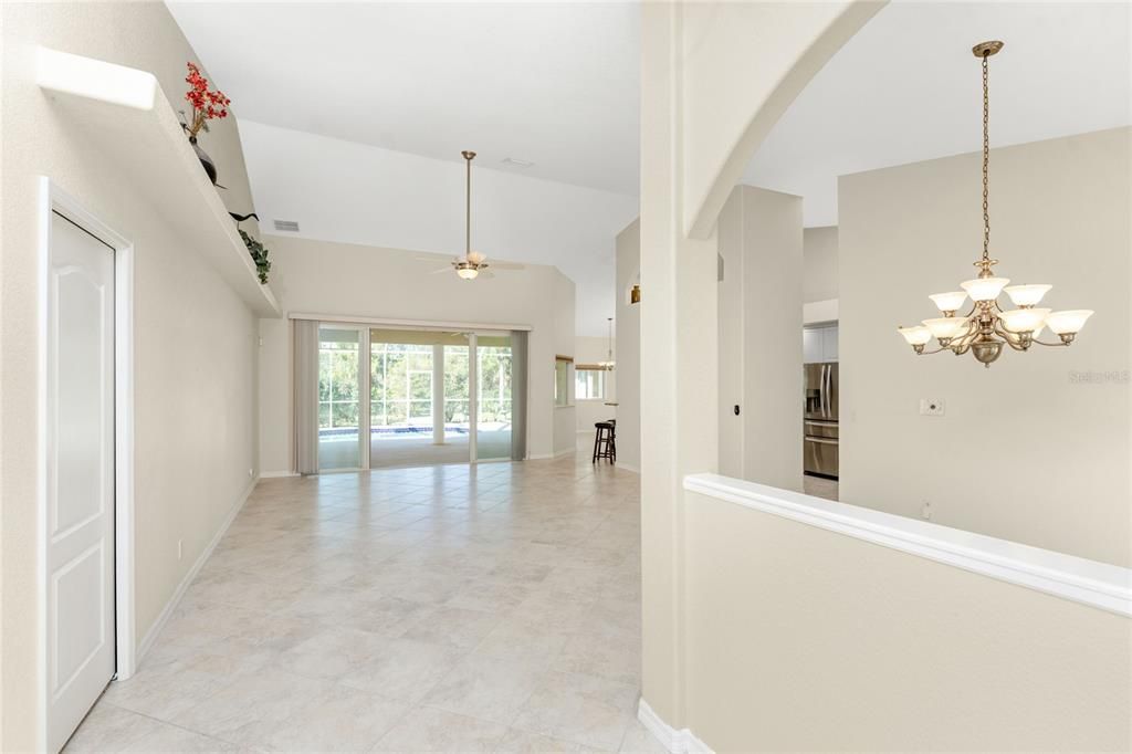 Entering the defined foyer provides a vista through the great room to the pool.