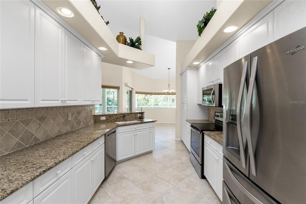 Tile backsplash blends with granite counters