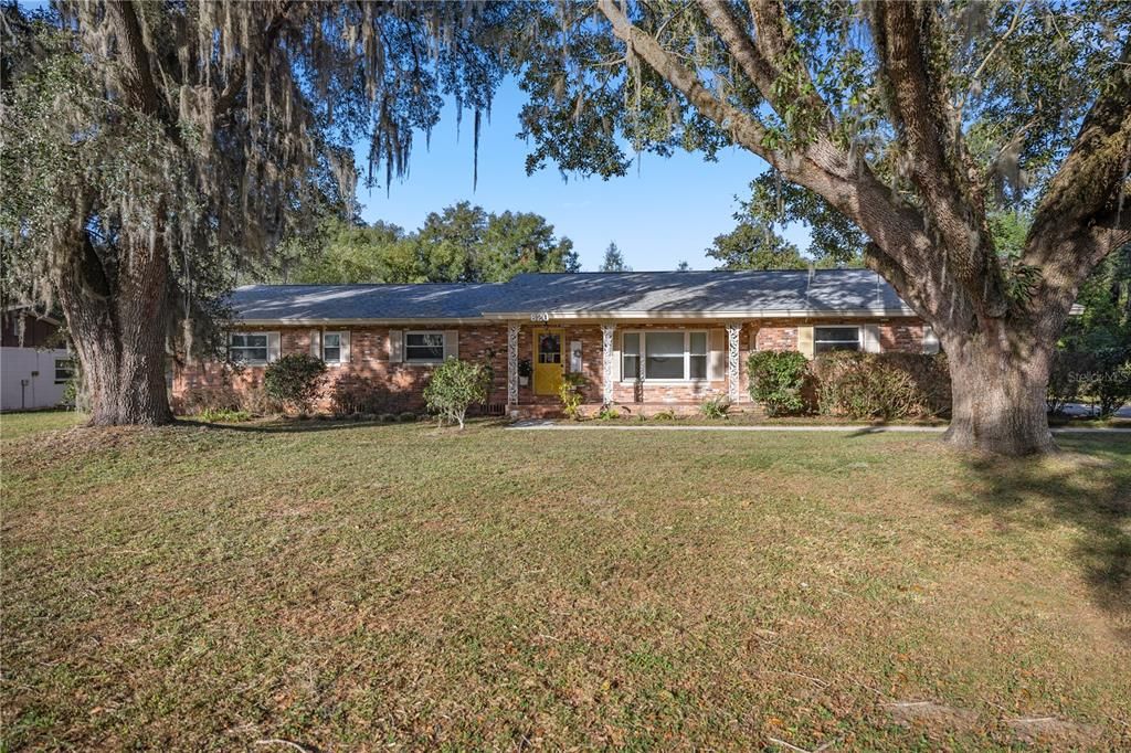 Spacious front yard with gorgeous trees