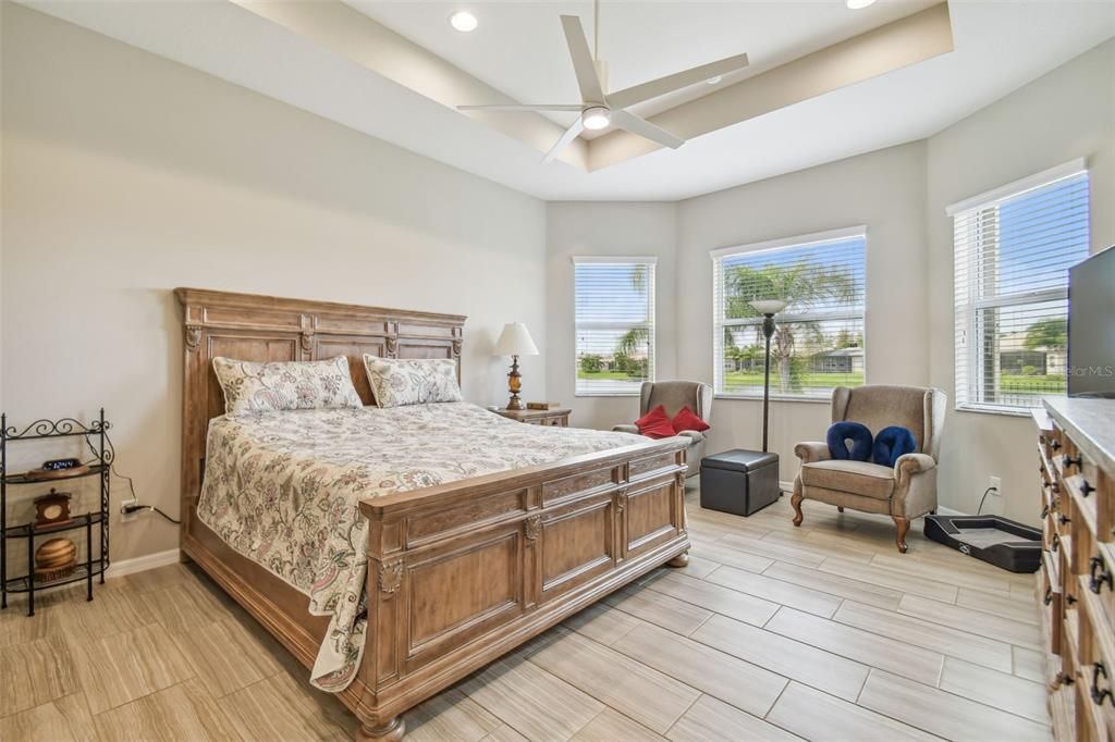 Primary bedroom overlooking pond