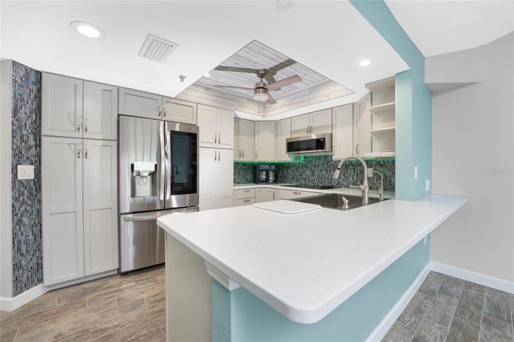 The kitchen is perfect for entertaining while cooking or preparing some snacks for your guests.