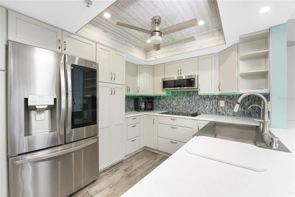 Cottage cabinetry and "ICE QUEEN" solid surface counter tops!