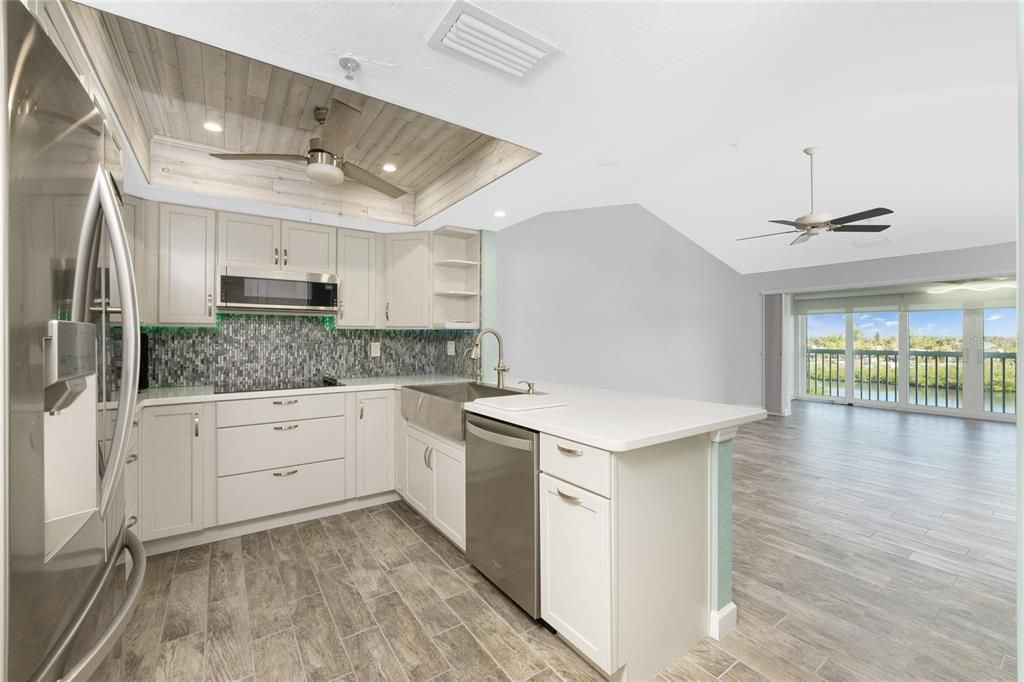 Tiled back splash, LED under cabinet lighting and ship lap boxed lighting!