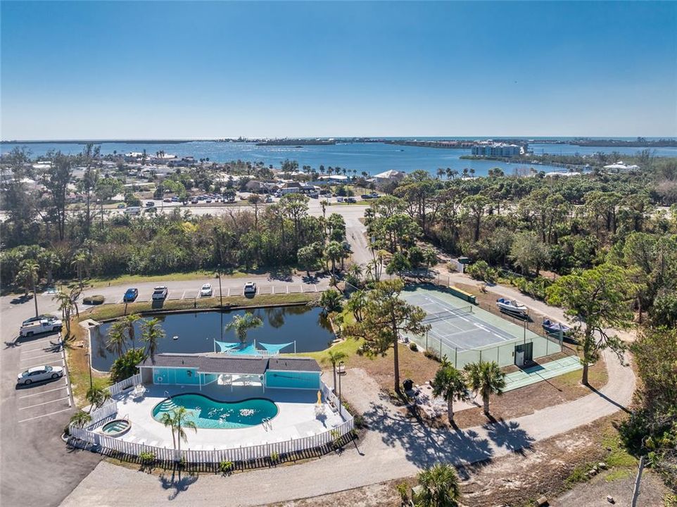 Aerial view of the community pool , hot tub and tennis courts!