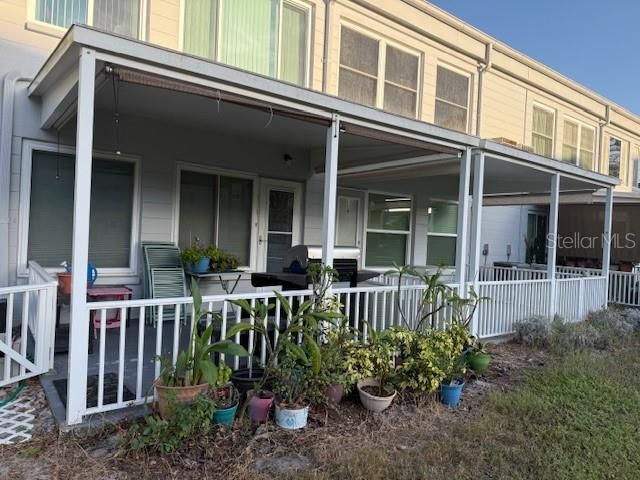 covered fenced back porch