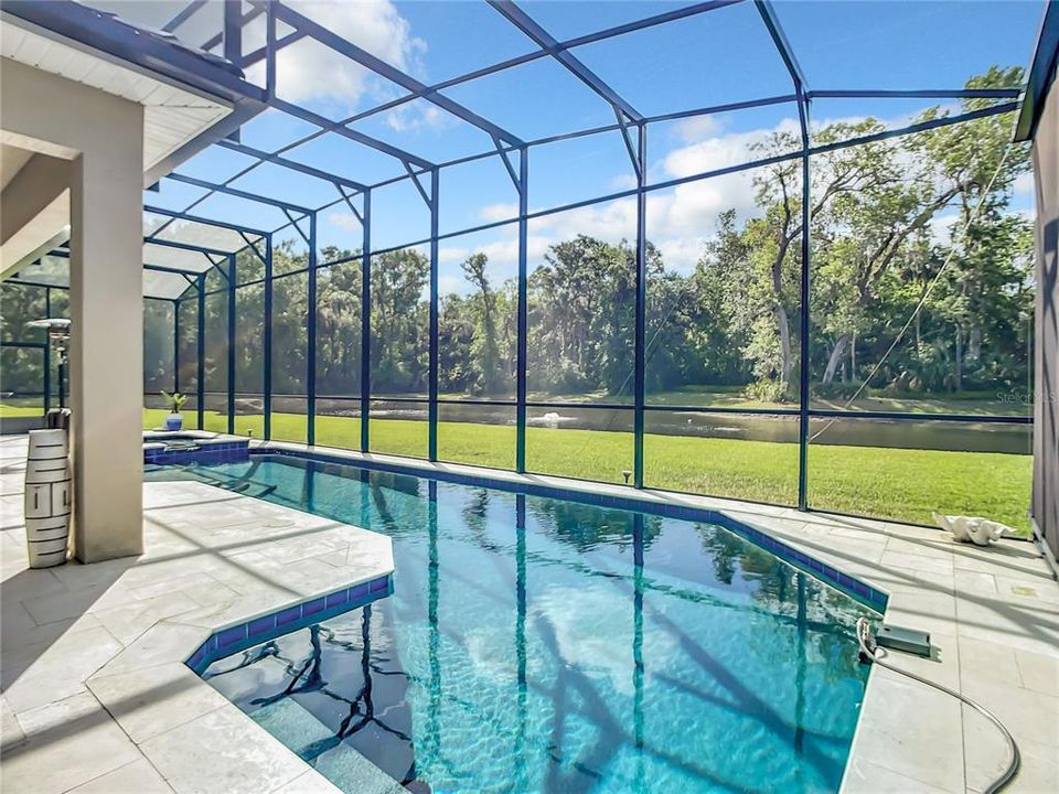 Heated pool and spa with screened pool enclosure