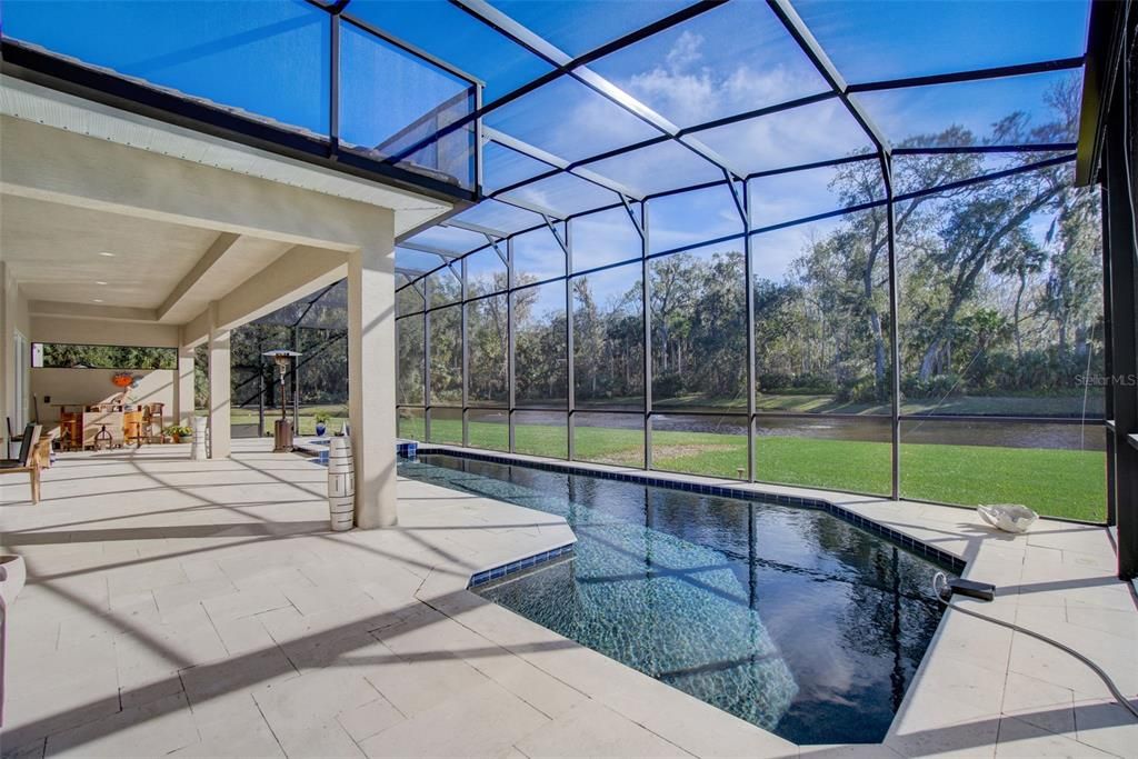 Heated pool and spa with screened pool enclosure