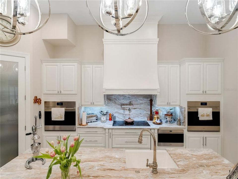 Kitchen with center island, double ovens