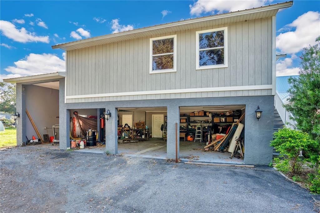 A spacious four-car garage with room for a lift, offering ultimate flexibility for car enthusiasts and storage needs.