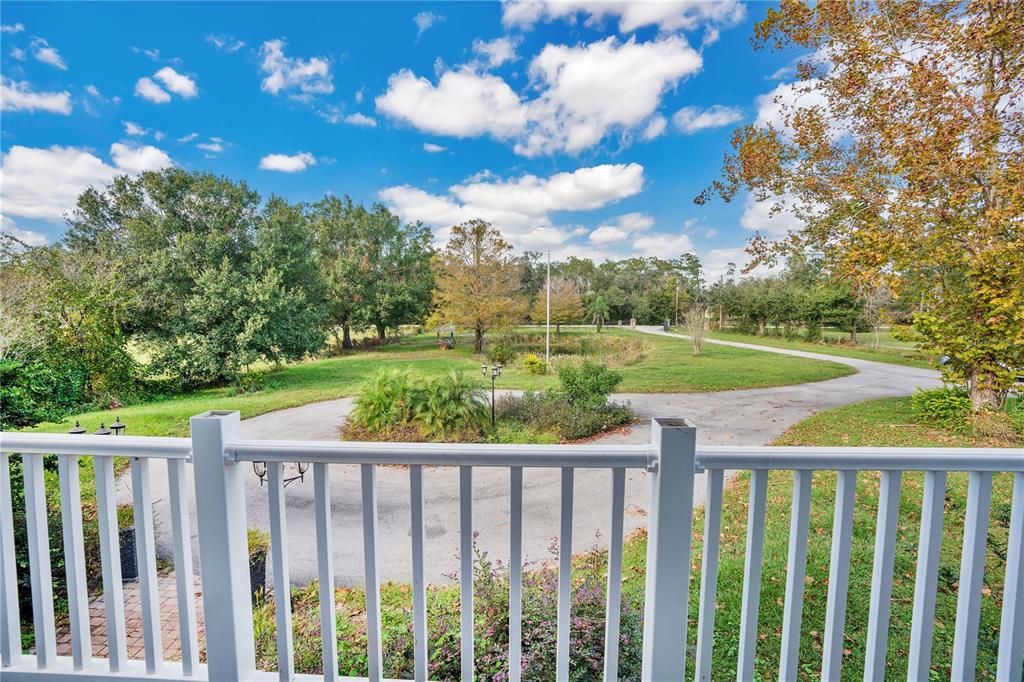 Wake up to serene views from the master bedroom, overlooking a peaceful pond and lush surroundings.