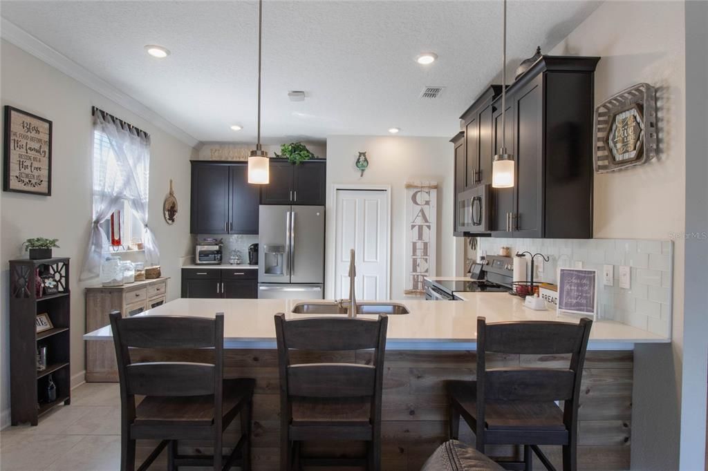 Pendant Lighting and Glass Tile Backsplash