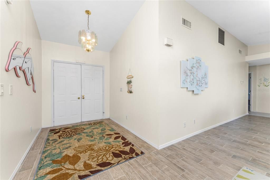 The light and bright walls are welcoming as you enter the living room.