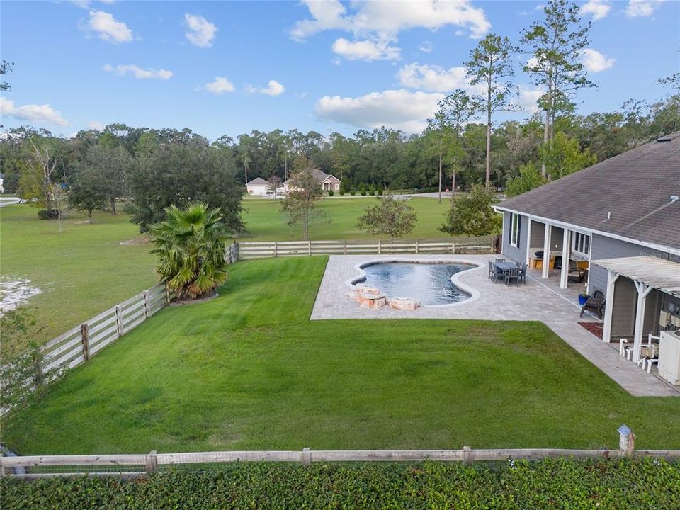 YARD HAS TWO FENCES, ONE CLOSE IN TO POOL AND SECOND AT PROPERTY LINE AT BACK OF PROPERTY