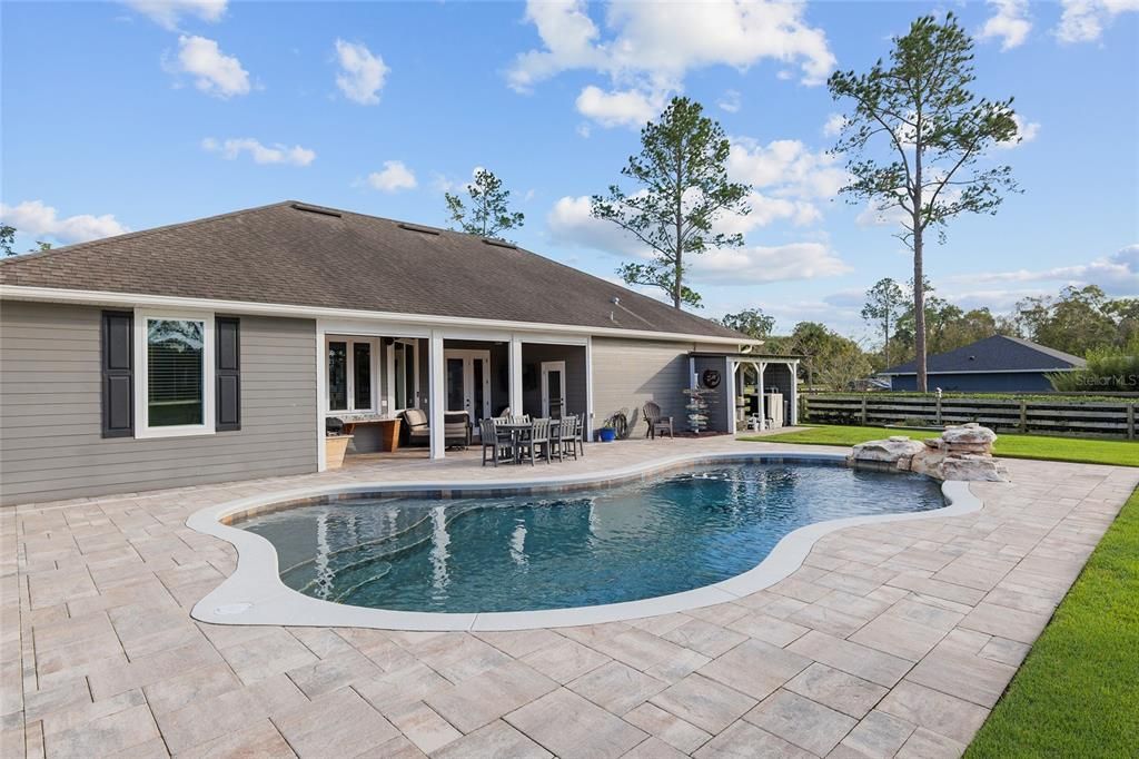 ENTIRE LANAI AND POOL AREA FEATURES BELGARD PAVERS