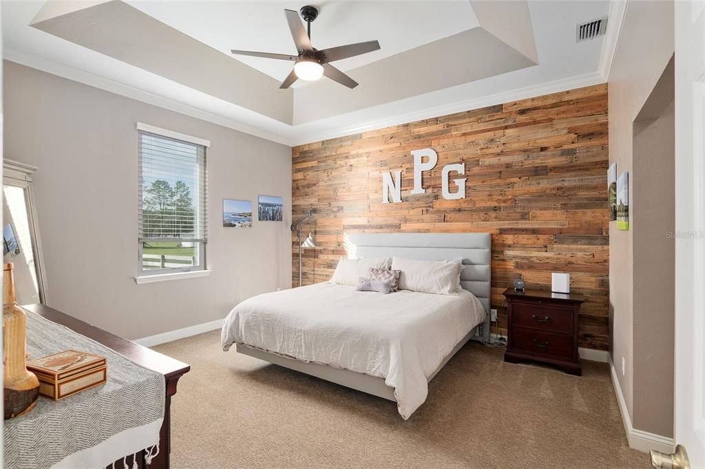 OWNER'S SUITE WITH RECLAIMED WOOD FEATURE WALL