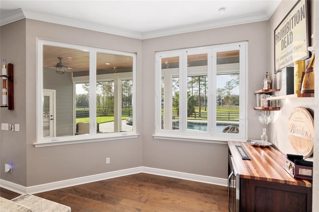 BREAKFAST NOOK ADJACENT TO KITCHEN WITH TRI-FOLD WINDOWS