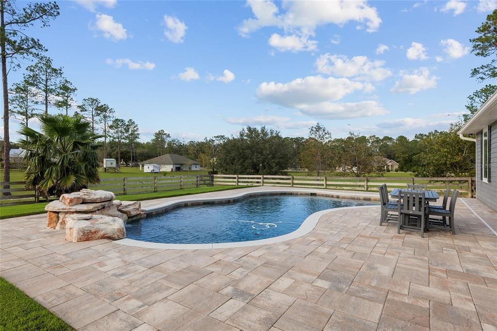 NEWER SALT POOL WITH WATERFALL FEATURE AND BEACH ENTRY