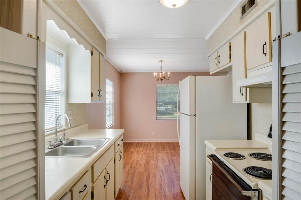 Kitchen taken from laundry room/storage area