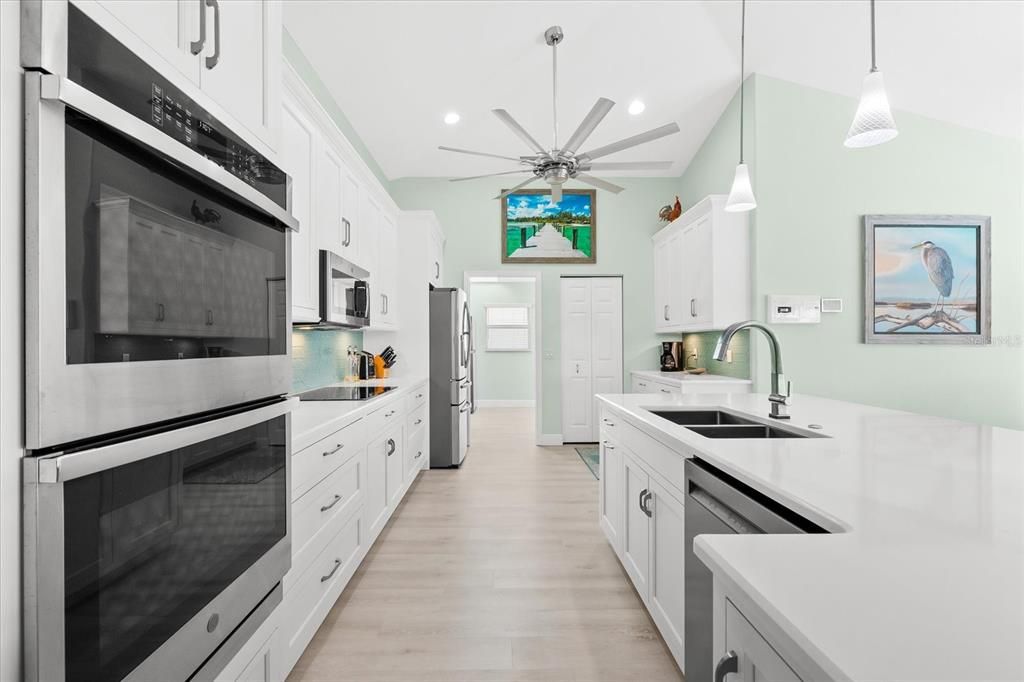 Kitchen - double oven, stone countertops and soft-close cabinetry