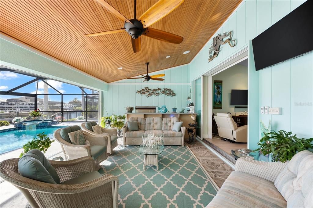 Expansive lanai showcasing gorgeous tongue-and-groove ceiling.