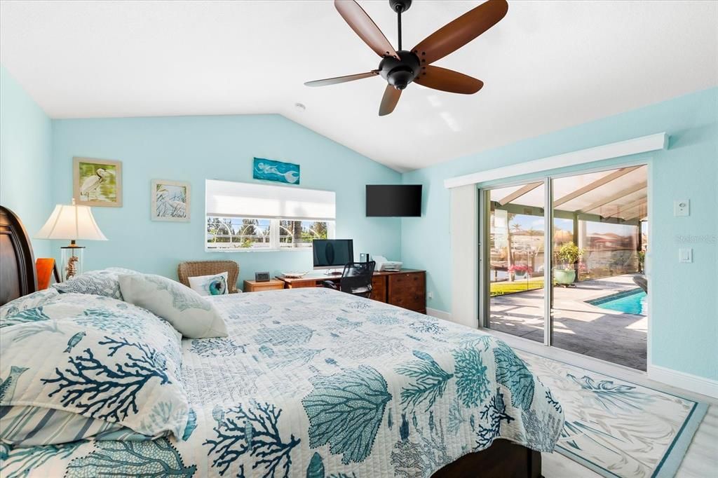 Guest room - with views of patio and pool.