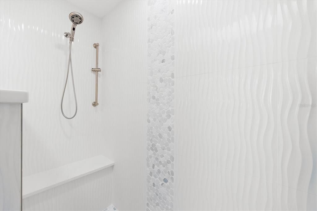 Guest bath shower - designed gorgeous custom tile.