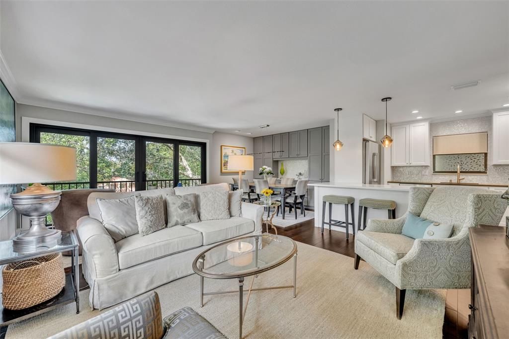 Inviting living area, perfect for entertaining.  Crown molding throughout and beautiful wood floors.