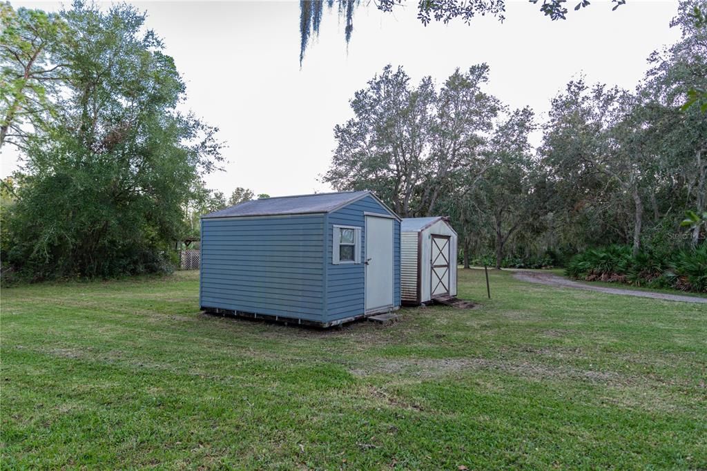 Two storage sheds in front of the property