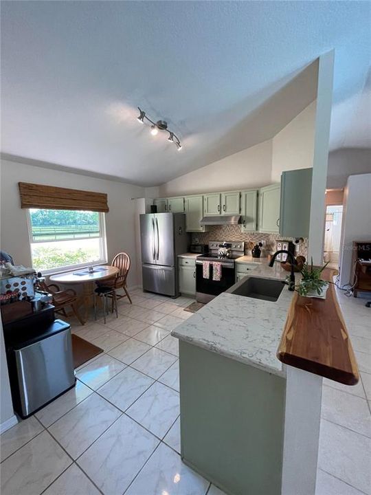 Updated Kitchen, quartz counters and farmhouse sink. Newer appliances