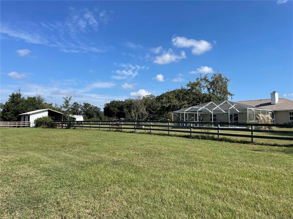 View of back of property house and barn