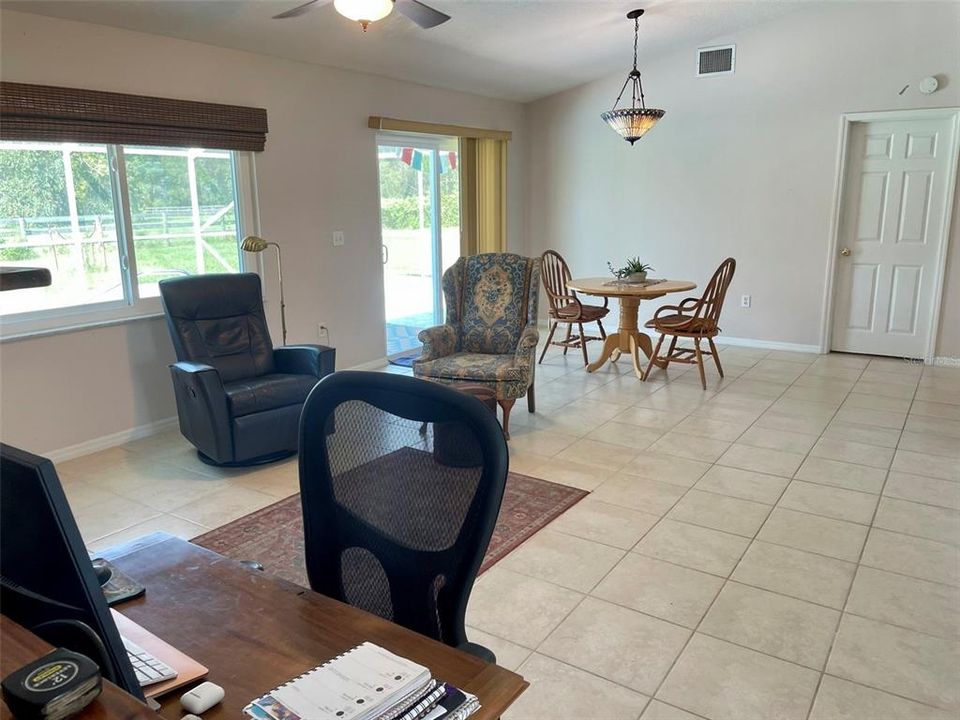 Other side of living room with sliders to the Pool area